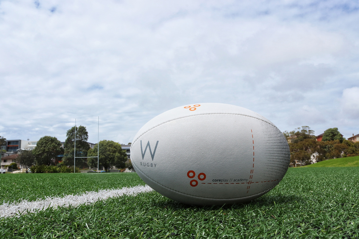 White Rugby Ball on the Grass